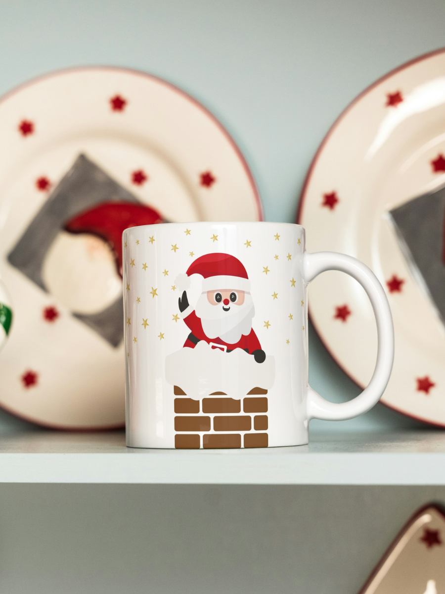 Caneca de Natal em cerâmica branca com estampa temática natalícia.