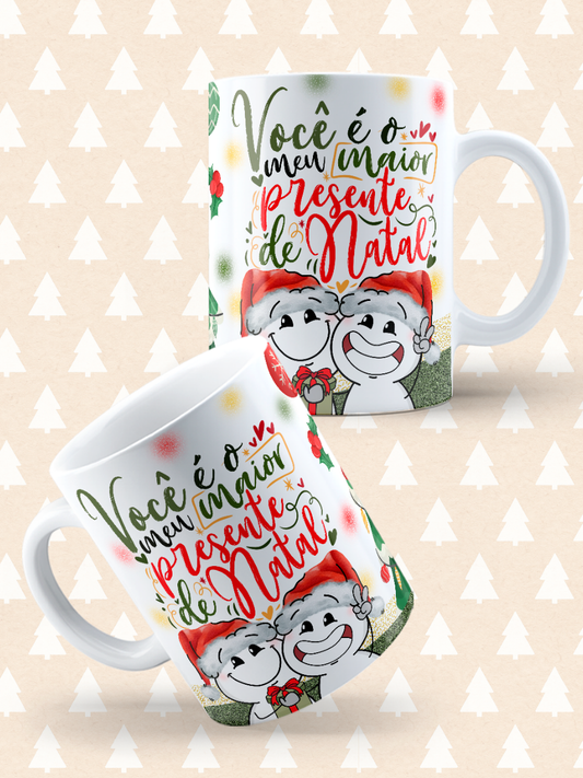 Caneca de Natal em cerâmica branca com estampa temática natalícia.