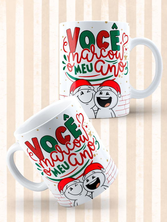 Caneca de Natal em cerâmica branca com estampa temática natalícia.